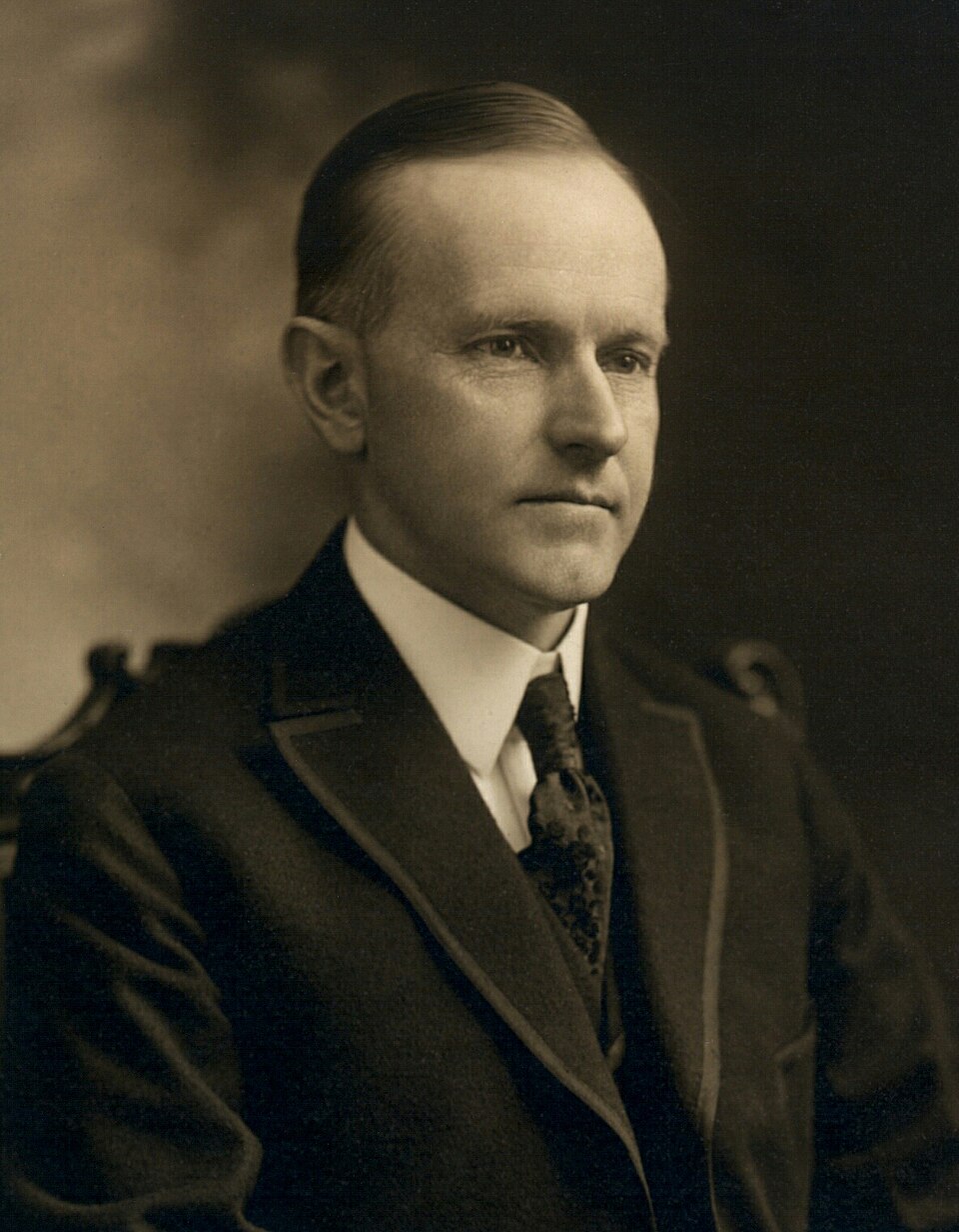 Calvin Coolidge, bw head and shoulders photo portrait seated, 1919