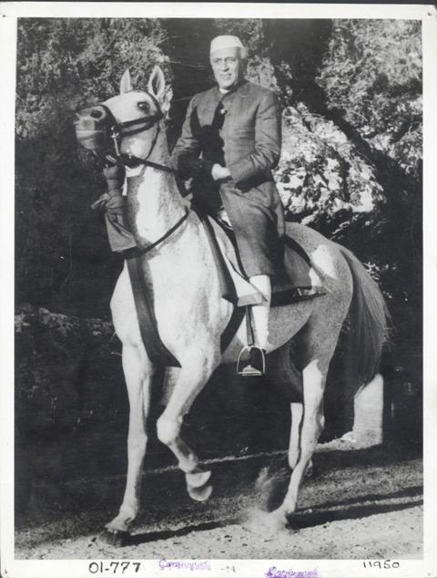 Jawaharlal Nehru on horseback in Achkan and chooridar