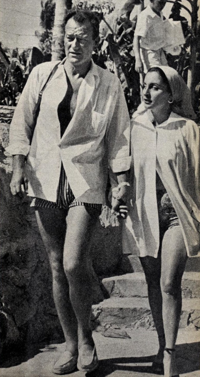 John Wayne with his third wife Pilar Pallete, 1954